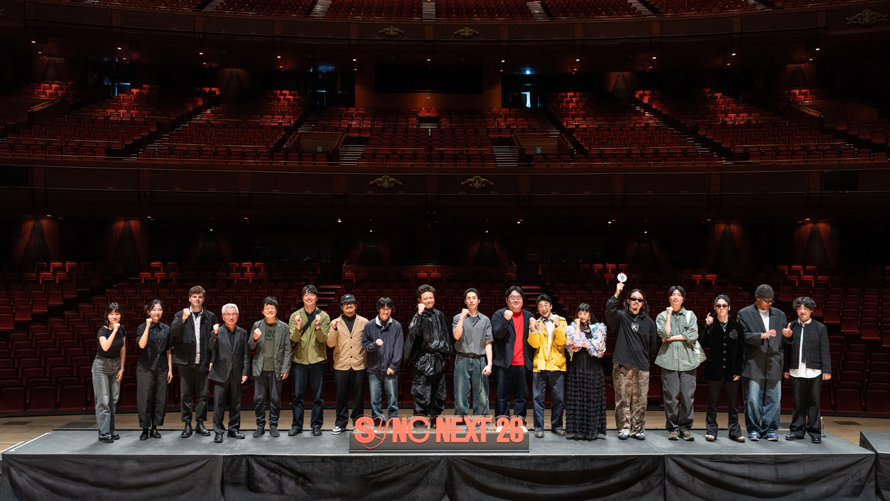 Participants of "Sync Next 2026" pose for photos during a press conference on April  27 at the Grand Theater of the Sejong Center for the Performing Arts.  (SCPA)