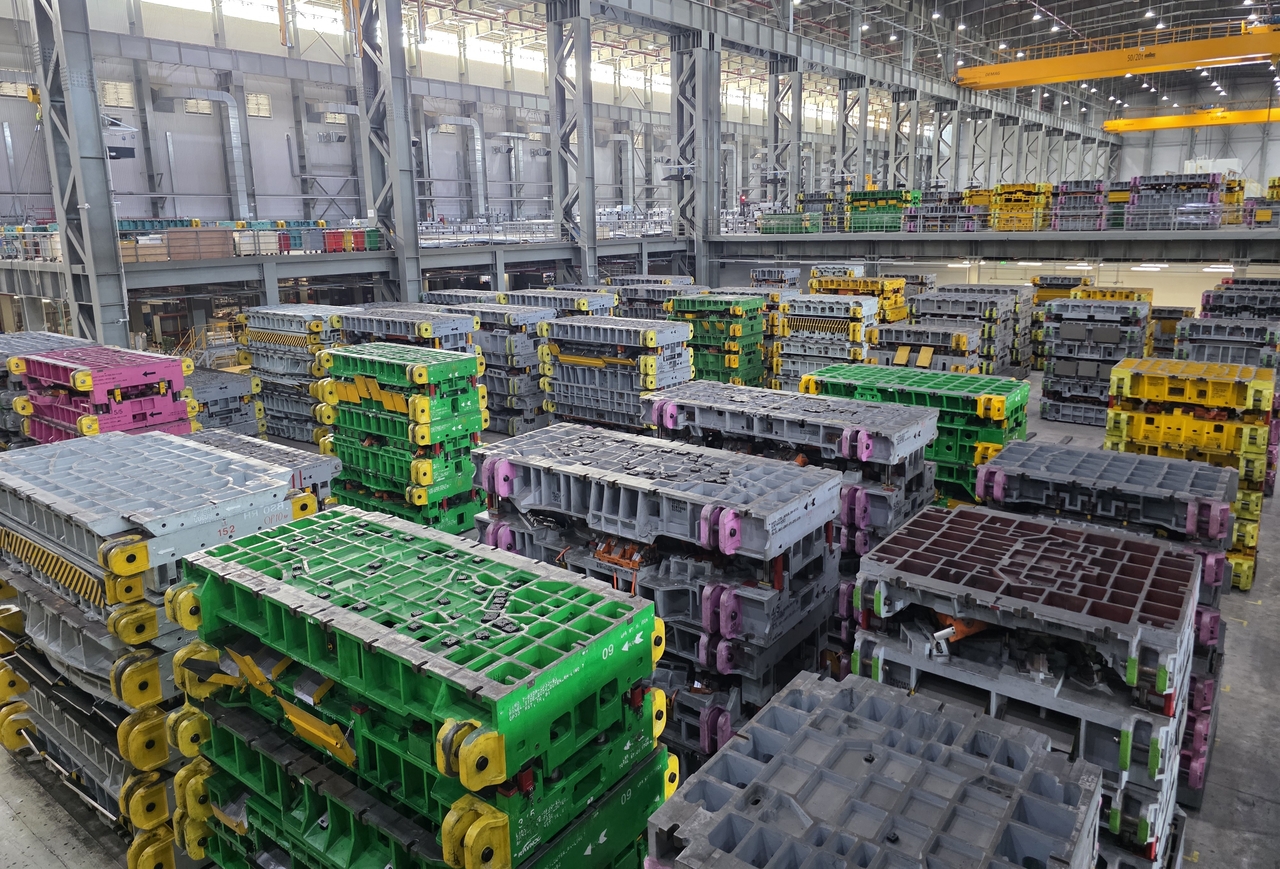 Press molds stored at VinFast's Haiphong factory in Vietnam on Thursday (local time). Molds are color-coded by vehicle model so different models can be distinguished even when produced on the same line. (Kwon Je-in/The Korea Herald)