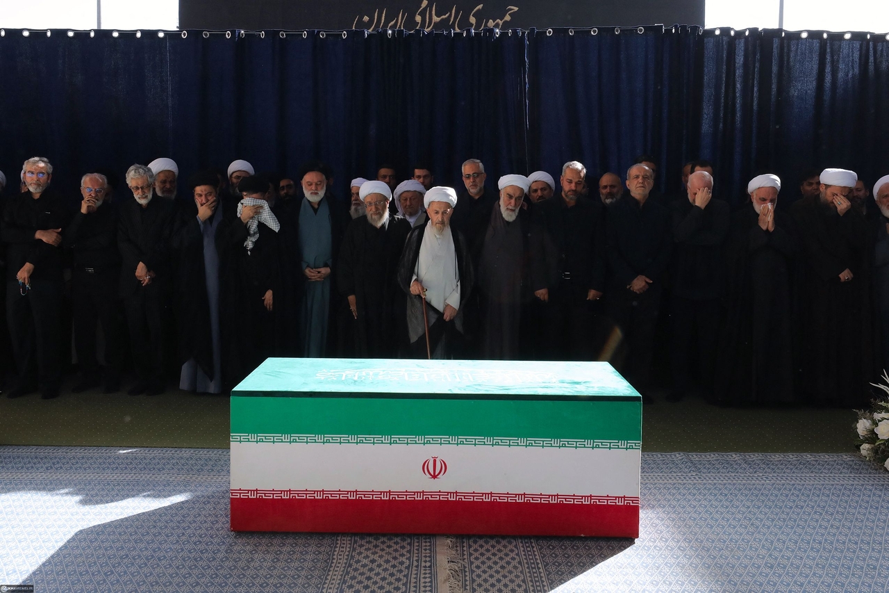 Iranian officials pay their respects to the coffin of Iran's slain supreme leader Ayatollah Ali Khamenei at the Grand Mosalla during the second day of his funeral ceremonies in Tehran on July 5, 2026. (AFP-Yonhap)