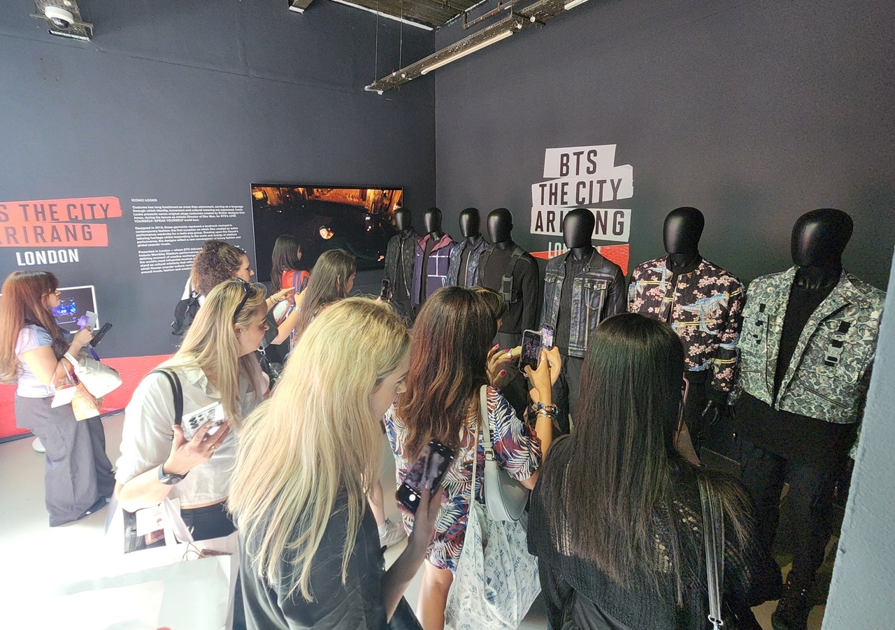 BTS' fans look at BTS' outfits from the 2019 BTS 'Love Yourself: Speak Yourself' Wembley concert in the Korean Cultural Centre UK during BTS The City Arirang London on July 4 (Yonhap)