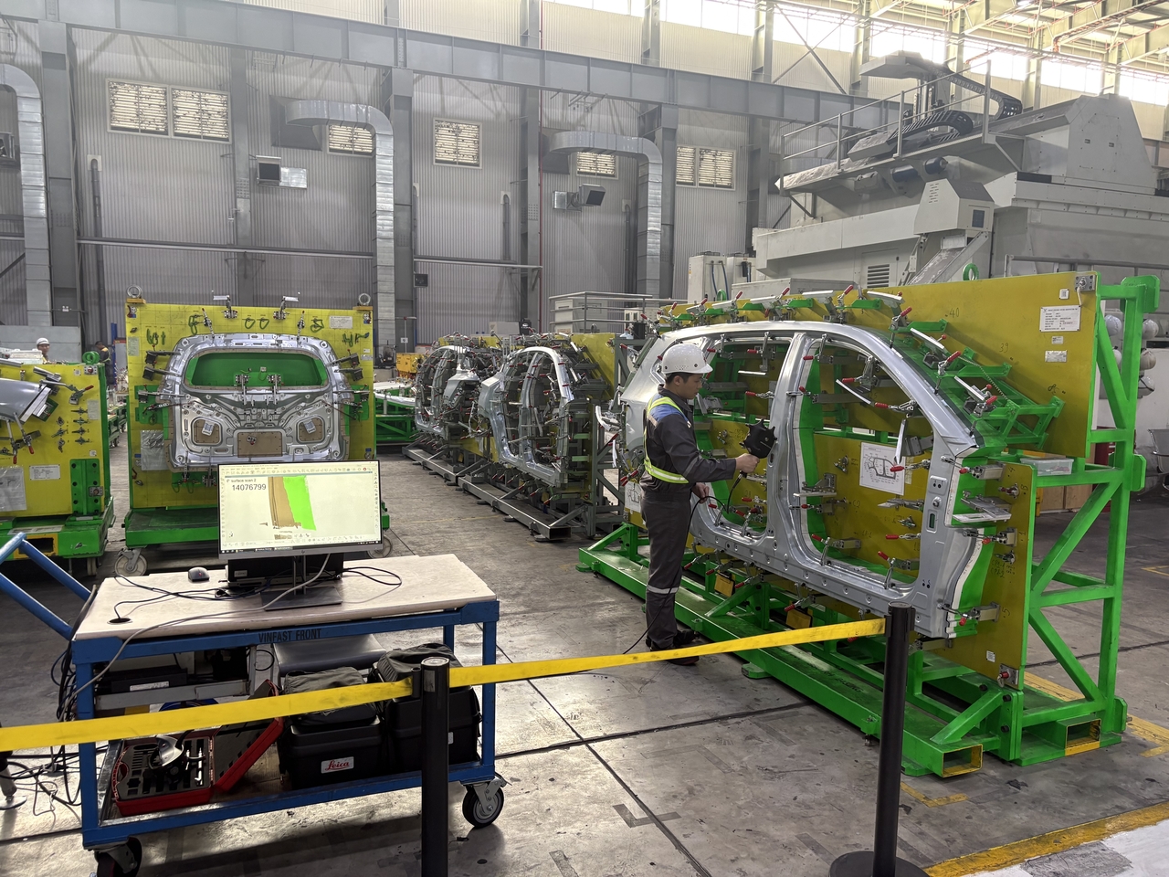 A worker at the press shop inspects vehicle panels one by one before they are transported to the body shop at VinFast's facility in Hai Phong, Vietnam. (KOTRA)