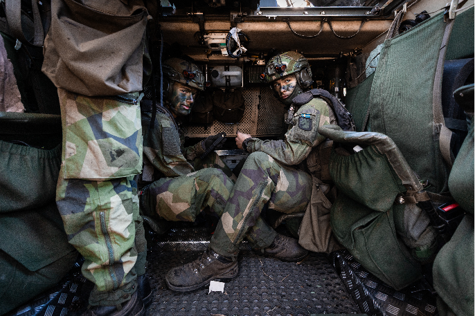 Soldiers with the Swedish Army’s South Skane Regiment load blank ammunition into magazines during Exercise Aurora 26 on April 29. (NATO)