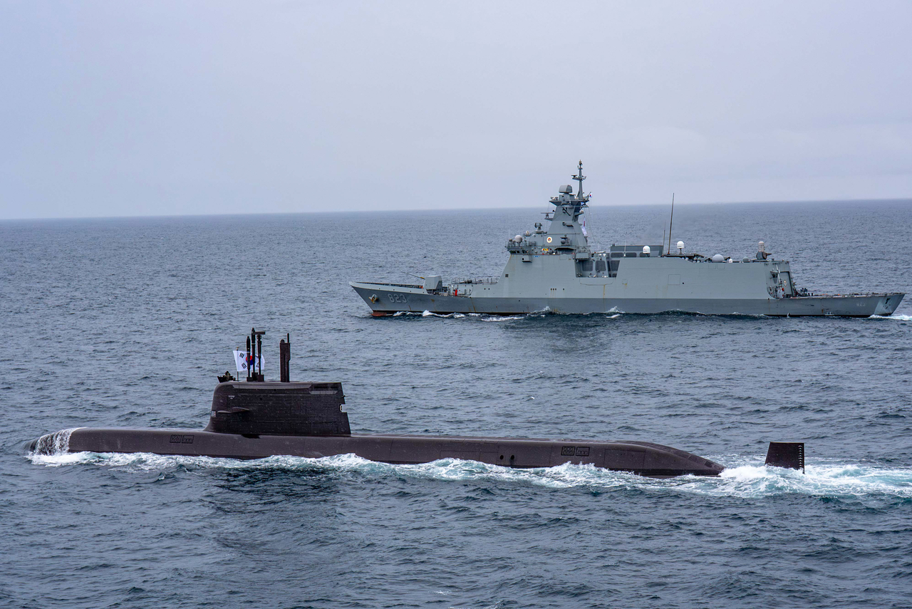The South Korean Navy’s Dosan Ahn Chang-ho submarine (front) and frigate Daejeon conduct a tactical maneuver during a joint naval exercise with Canada off Canada’s western coast on June 4-5. The exercise also involved Canada’s submarine Corner Brook and frigate Ottawa. (Republic of Korea Navy)