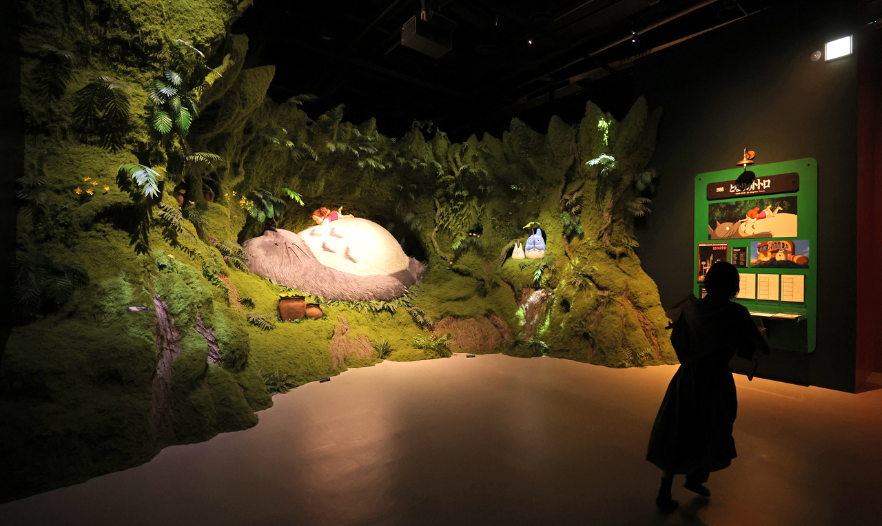 A visitor views a "My Neighbor Totoro" exhibit at the Studio Ghibli Exhibition in Jeju on Saturday. (Yonhap)