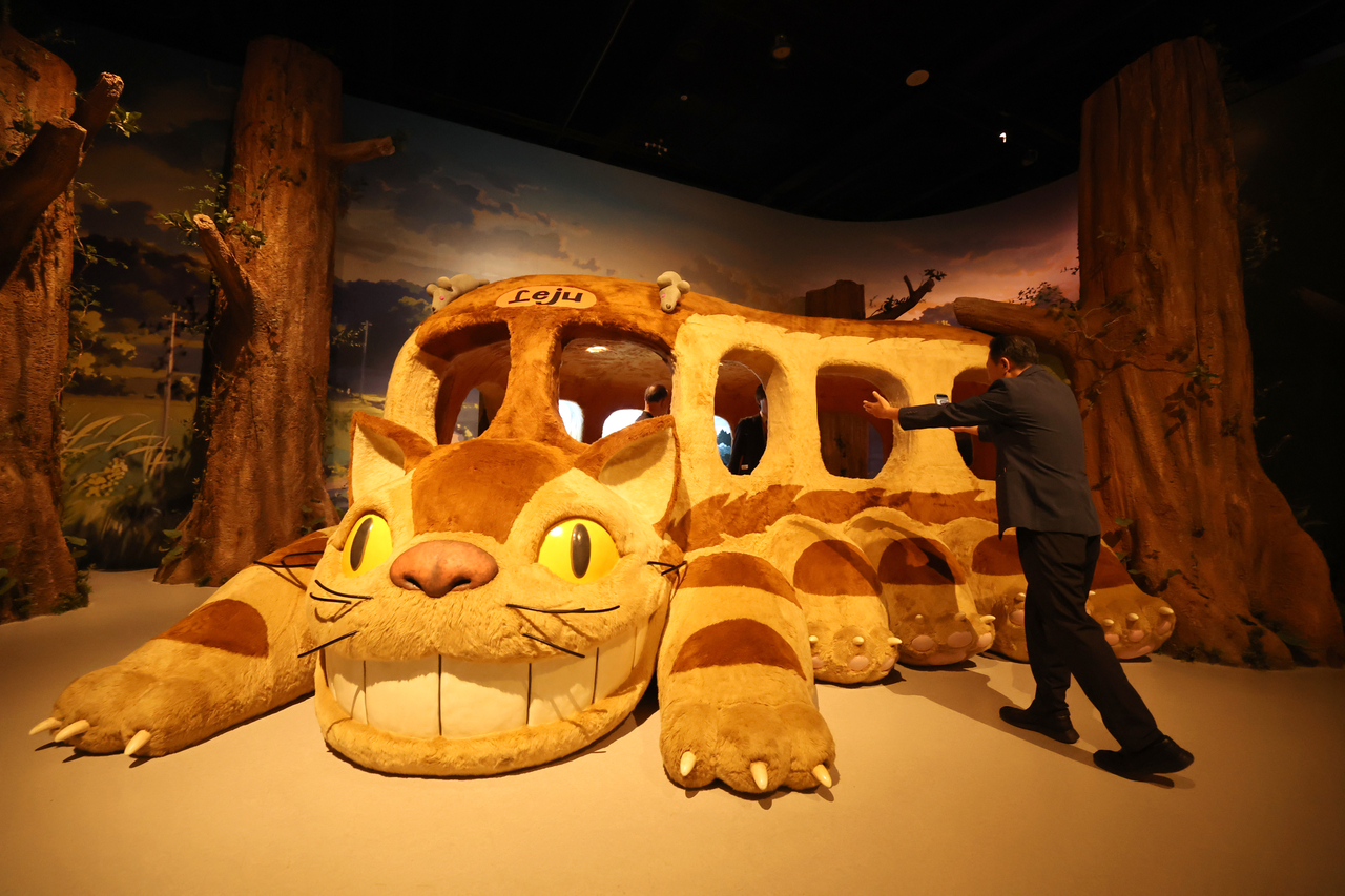 A visitor explores the Studio Ghibli Exhibition in Jeju on Saturday. (Yonhap)