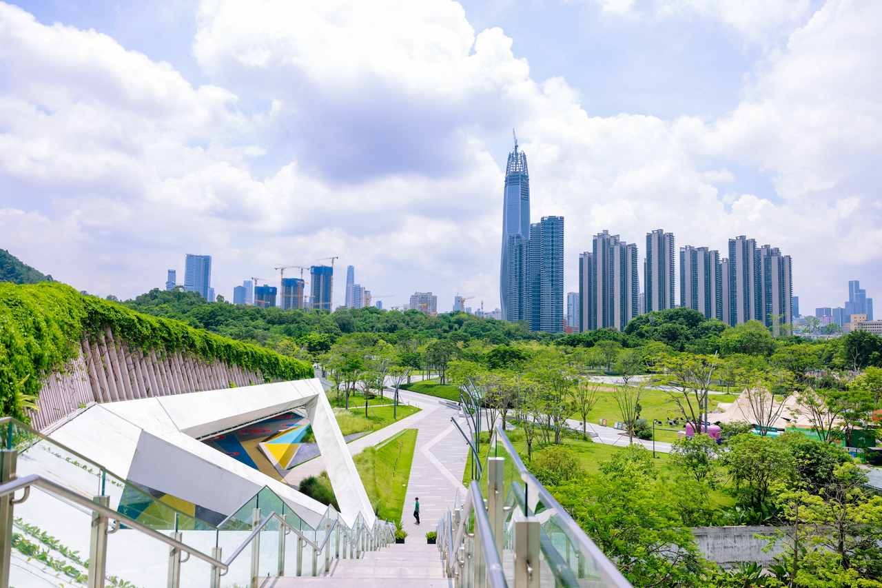 An elevated skywalk linked to the UpperHills complex descends toward a park in Shenzhen, China, in this photo taken on June 24. (Xinhua News Agency)