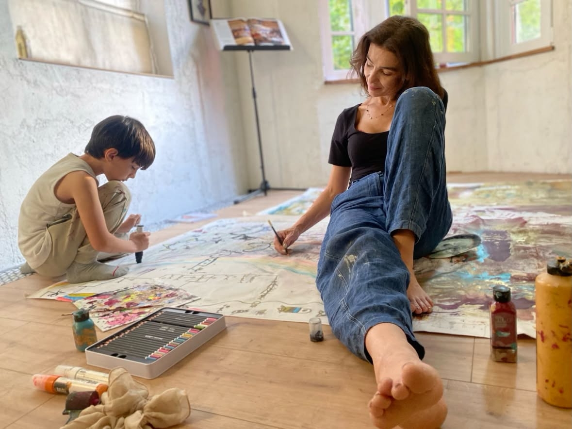 A picture of Patron and her youngest son, Boris, working together on a painting for their exhibition in Seoul. (Courtesy of Patron)