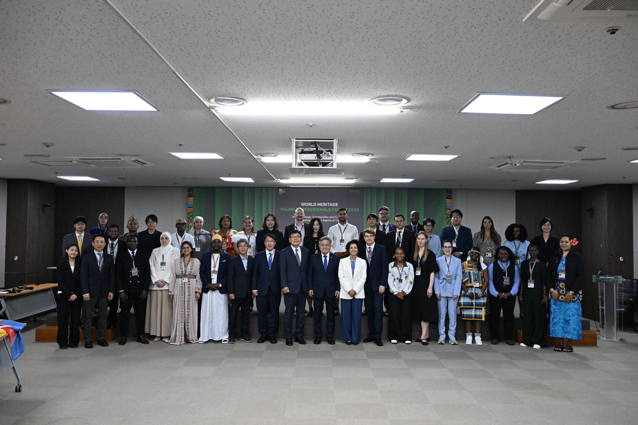 Participants in the 2026 World Heritage Young Professionals Forum pose for a group photo at the National Palace Museum of Korea in Seoul on Monday. (Korea Heritage Service)