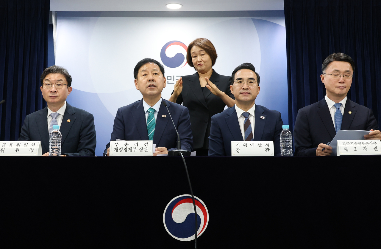Deputy Prime Minister and Finance Minister Koo Yun-cheol (second from left) speaks during a joint government briefing in Seoul on Tuesday. (Yonhap)