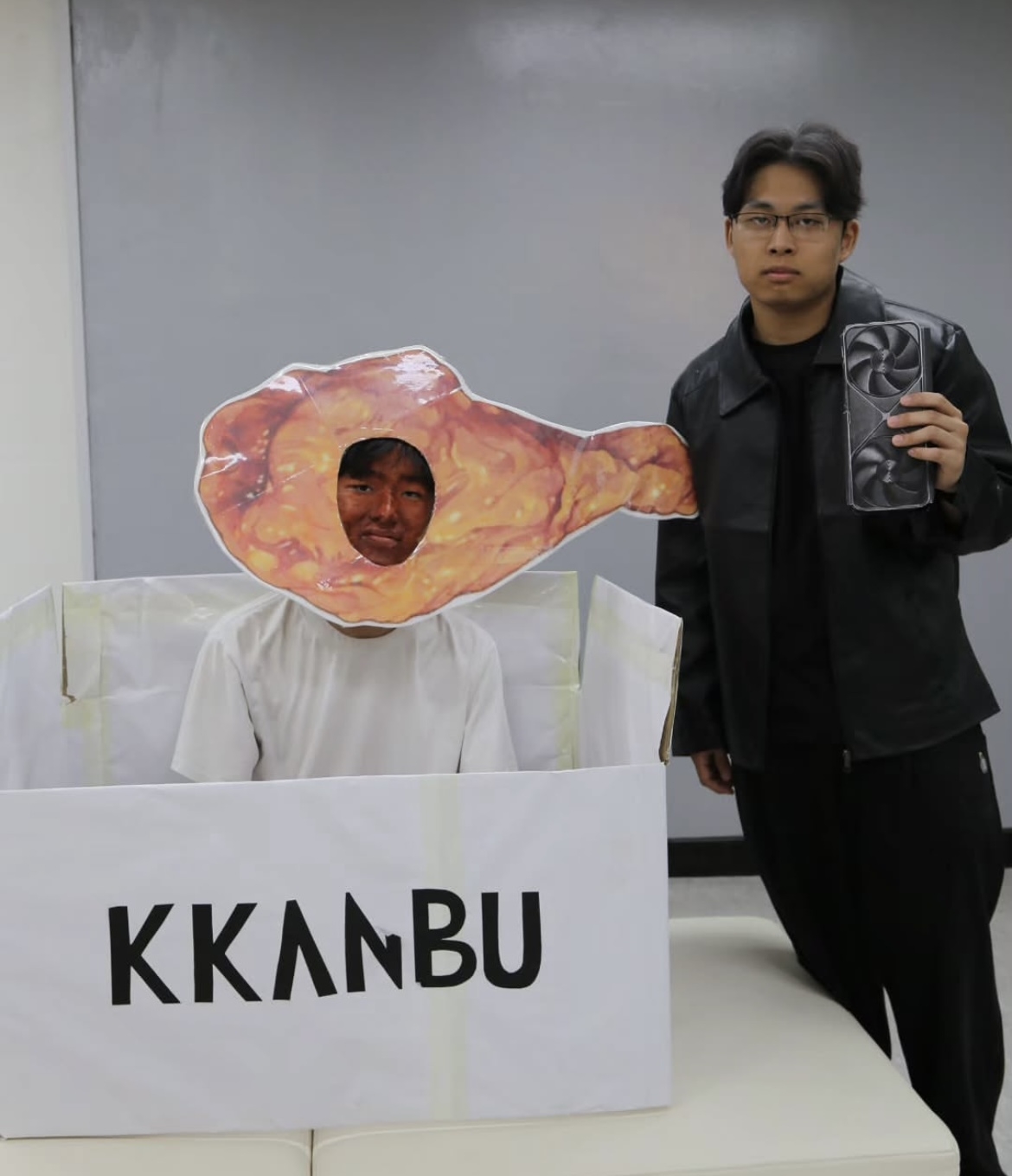 Uijeongbu High School seniors dress as Nvidia CEO Jensen Huang and Kkanbu Chicken for their graduation photo, released Monday. (@uhbs.official)