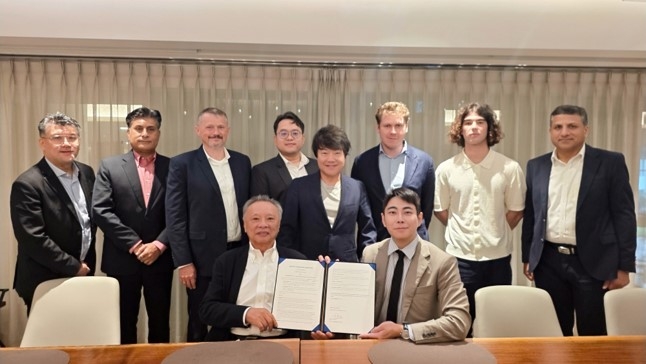 Lee Wook, CEO of Edena Korea (front row, right), and David Lim, co-CEO of Silverlake Axis Group (front row, left), pose with company officials after signing the joint venture agreement. [Edena Korea]