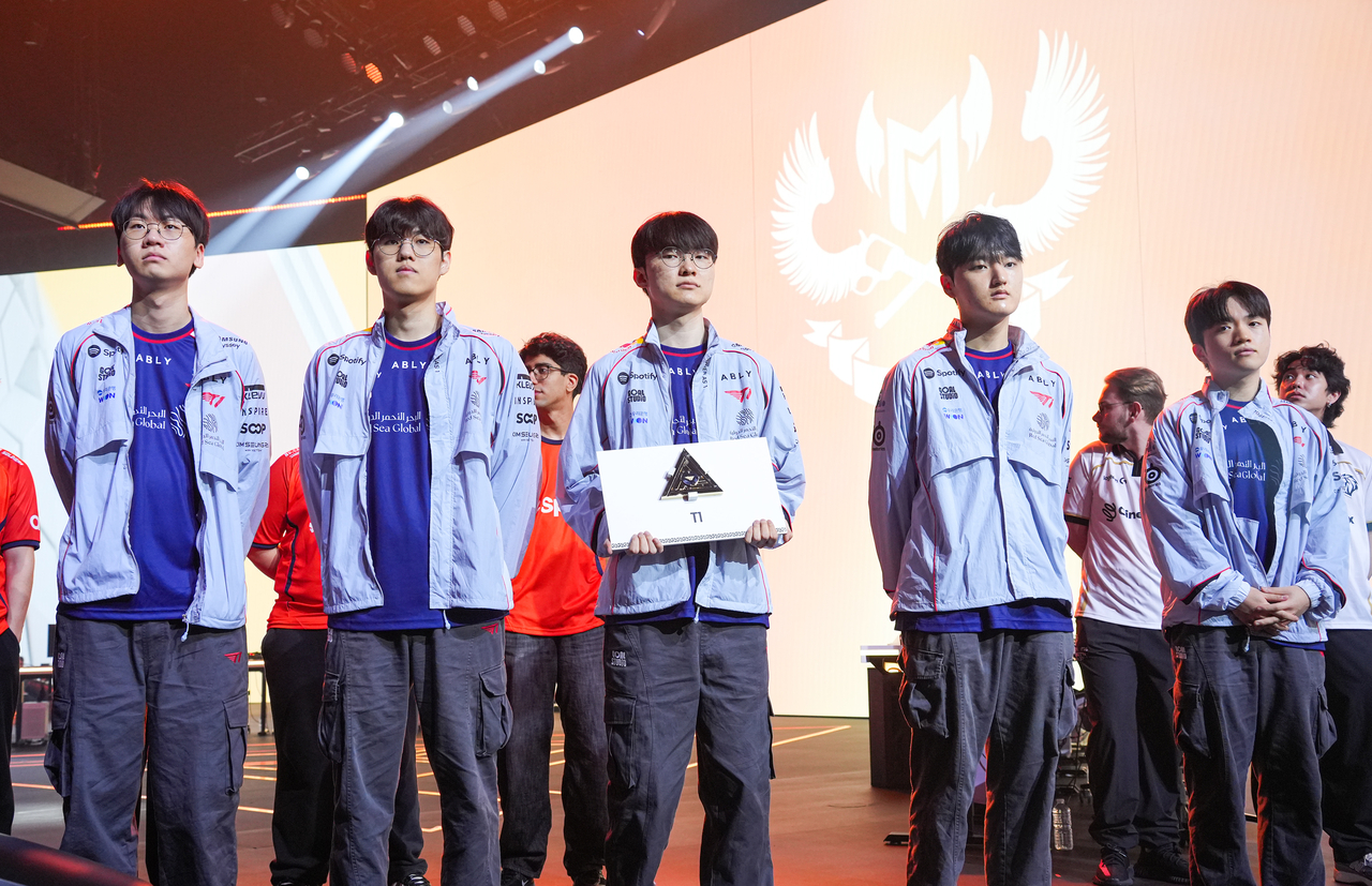T1 players take the stage during the opening ceremony for the LoL tournament at the 2026 Esports World Cup held in France on Wednesday. (Yonhap)