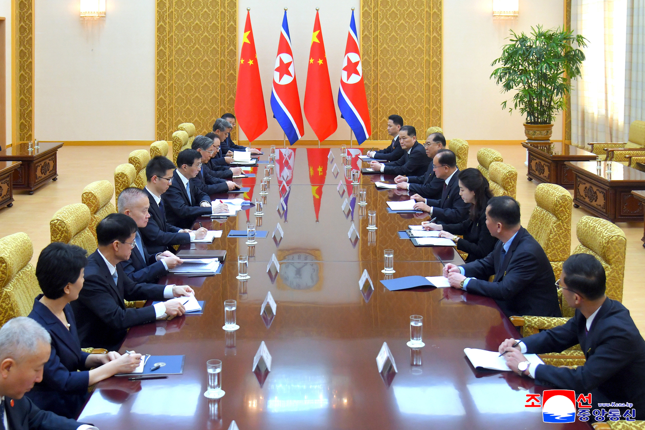 This photo shows Jo Yong-won, a secretary of the Central Committee of the Workers' Party of Korea, and Wang Huning, chairman of the Chinese People's Political Consultative Conference, holding talks in Pyongyang on Wednesday. (KCNA via Yonhap)