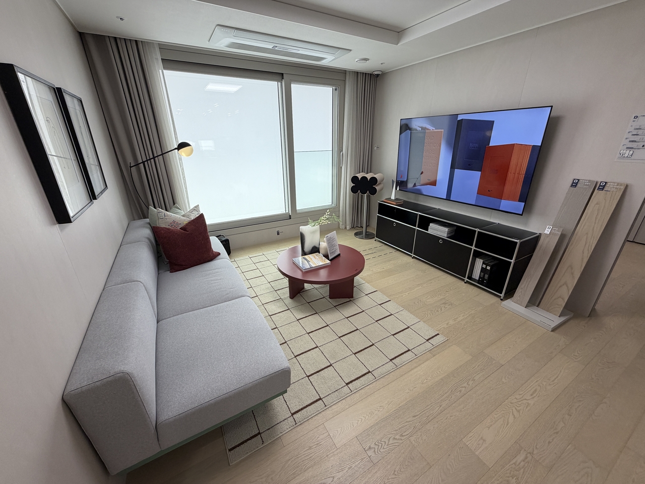 The living room of a 59-square-meter unit on display at the Acro River Sky model home. [Herald DB]