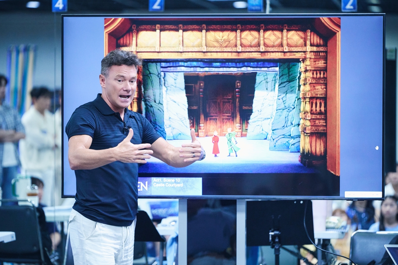 Associate director Adrian Sarple gestures during rehearsal for the musical "Frozen." (Clip Service)