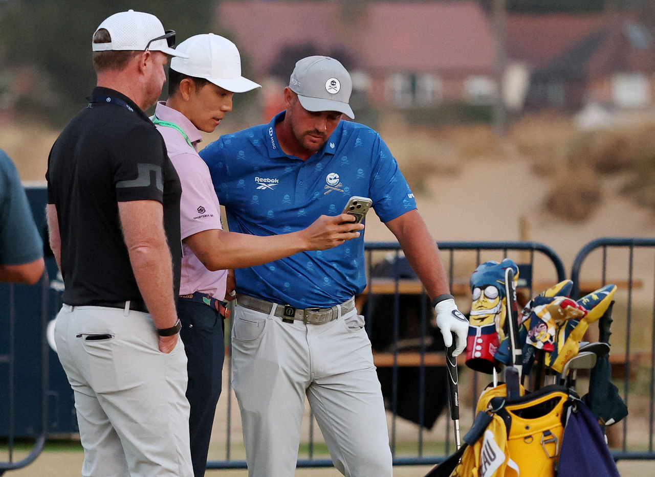 Bryson DeChambeau receives a two-stroke penalty for improving his lie on the fifth hole. [Photo=THE R&A]