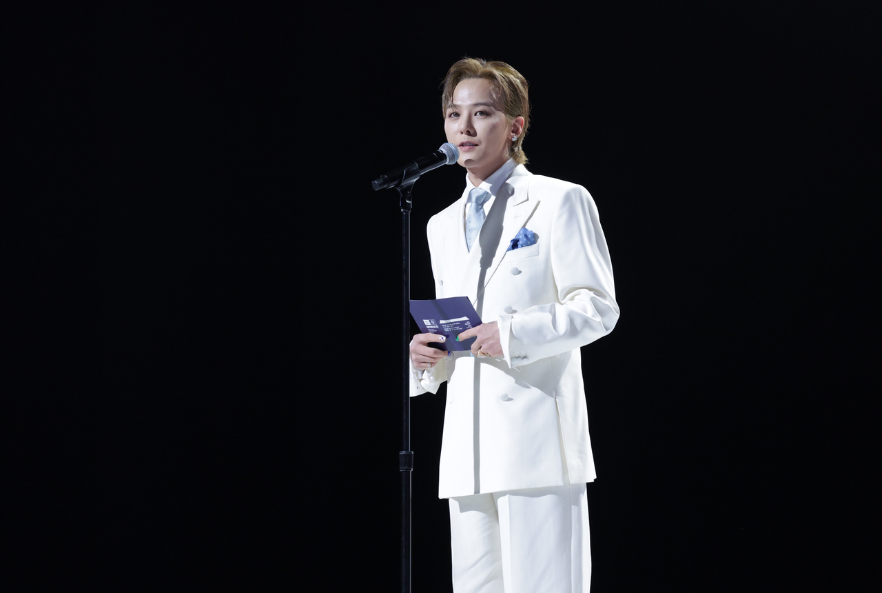 G-Dragon speaks at the opening ceremony of the 48th session of the World Heritage Committee in Busan on Sunday. (Yonhap)