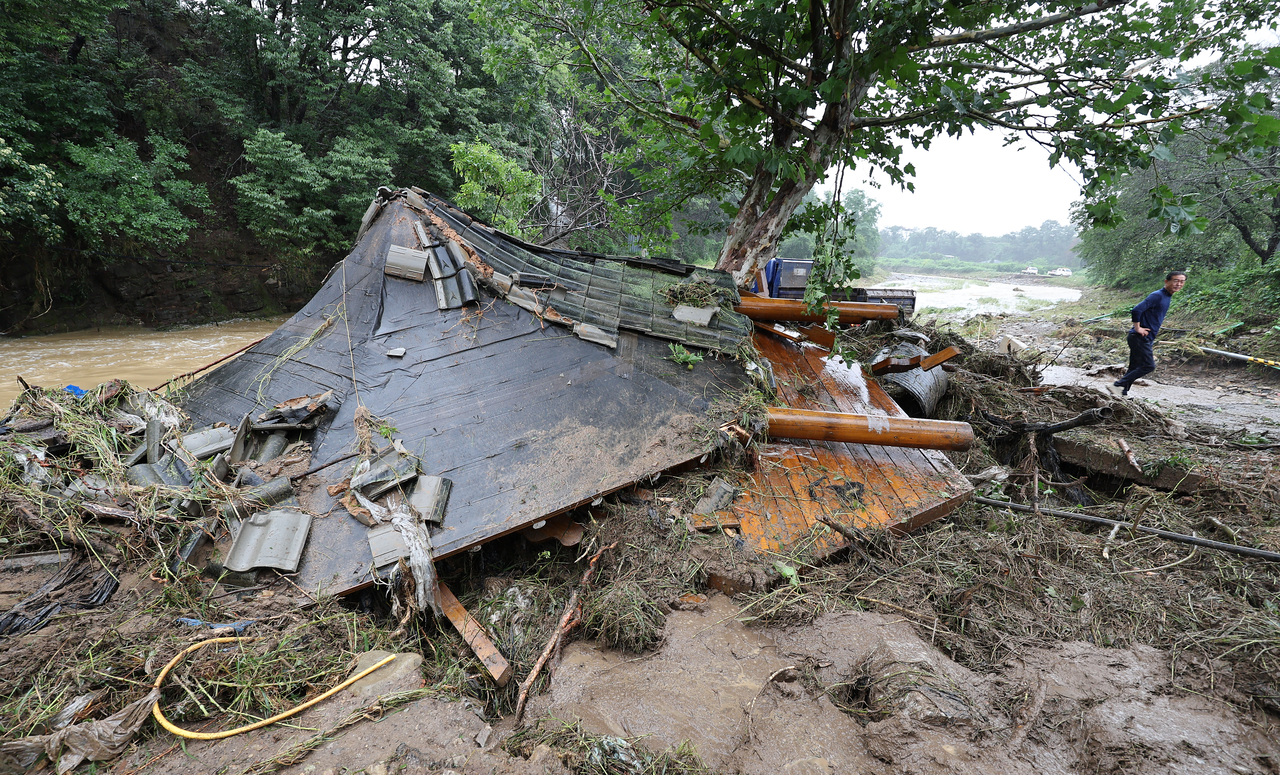 A pavilion in Andong, North Gyeongsang Province, lies collapsed after being destroyed by torrential rain on Saturday. (Yonhap)
