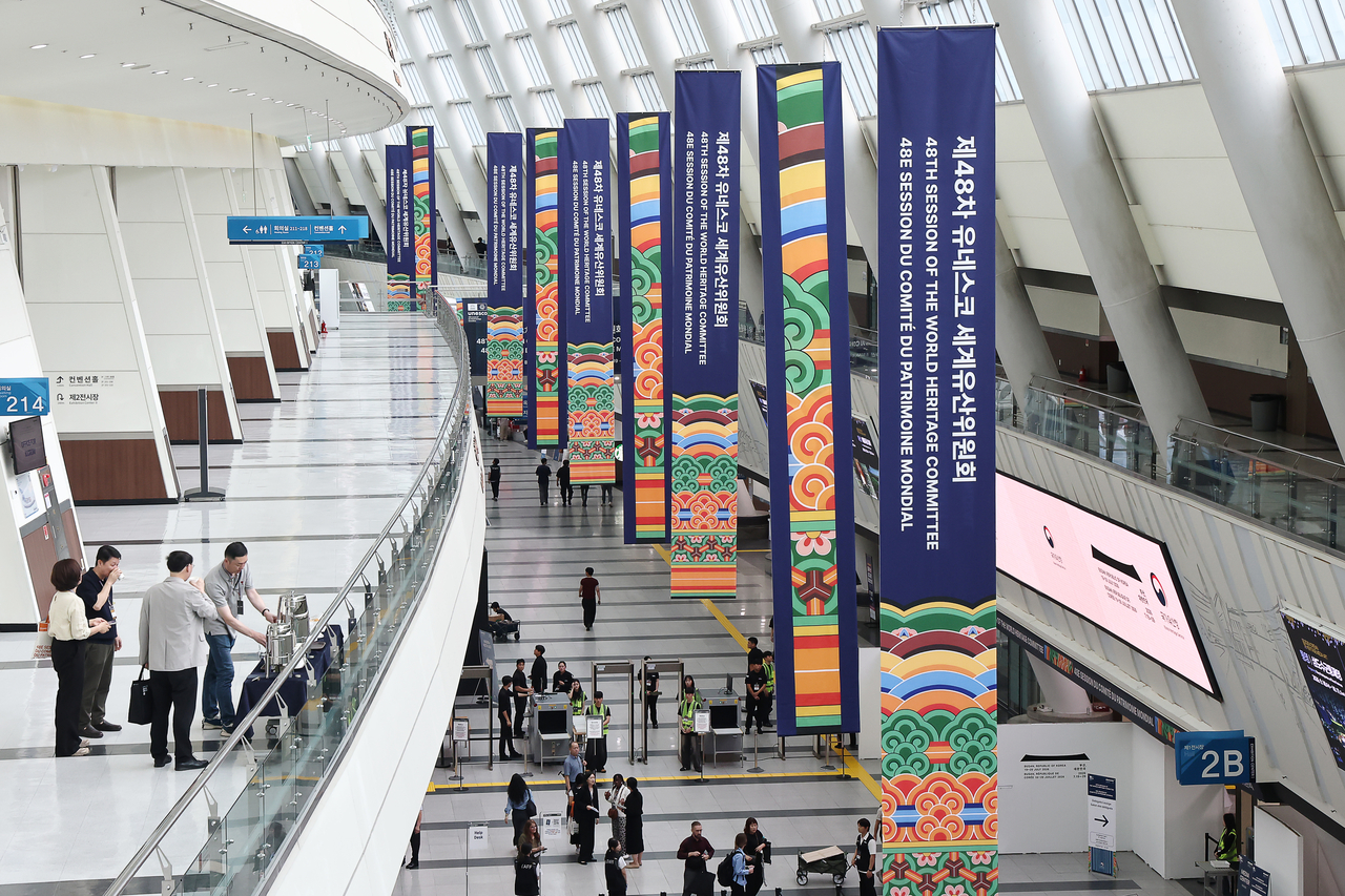 Banners for the 48th session of the UNESCO World Heritage Committee hang inside the Busan Exhibition and Convention Center (BEXCO) in Busan on Sunday, ahead of the annual meeting's opening ceremony. (Yonhap)