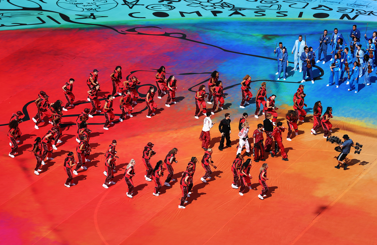 BTS performs "Dynamite" during the FIFA World Cup halftime show for the final match between Spain and Argentina at MetLife Stadium in New Jersey on Sunday. (Getty Images)