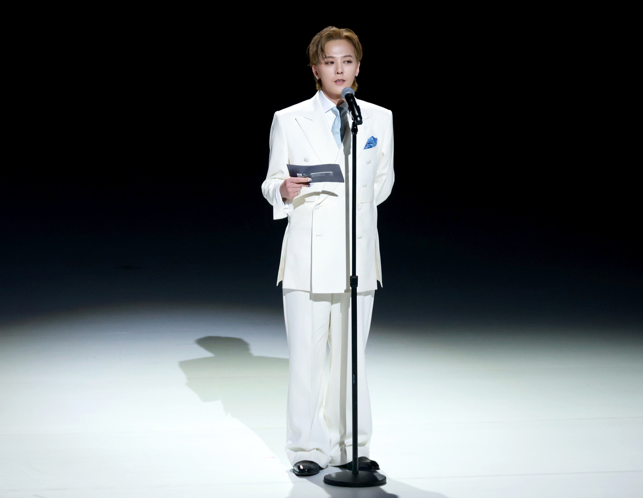 G-Dragon, honorary ambassador for the 48th session of the UNESCO World Heritage Committee, delivers remarks during the opening ceremony on Sunday in Busan. (Yonhap)
