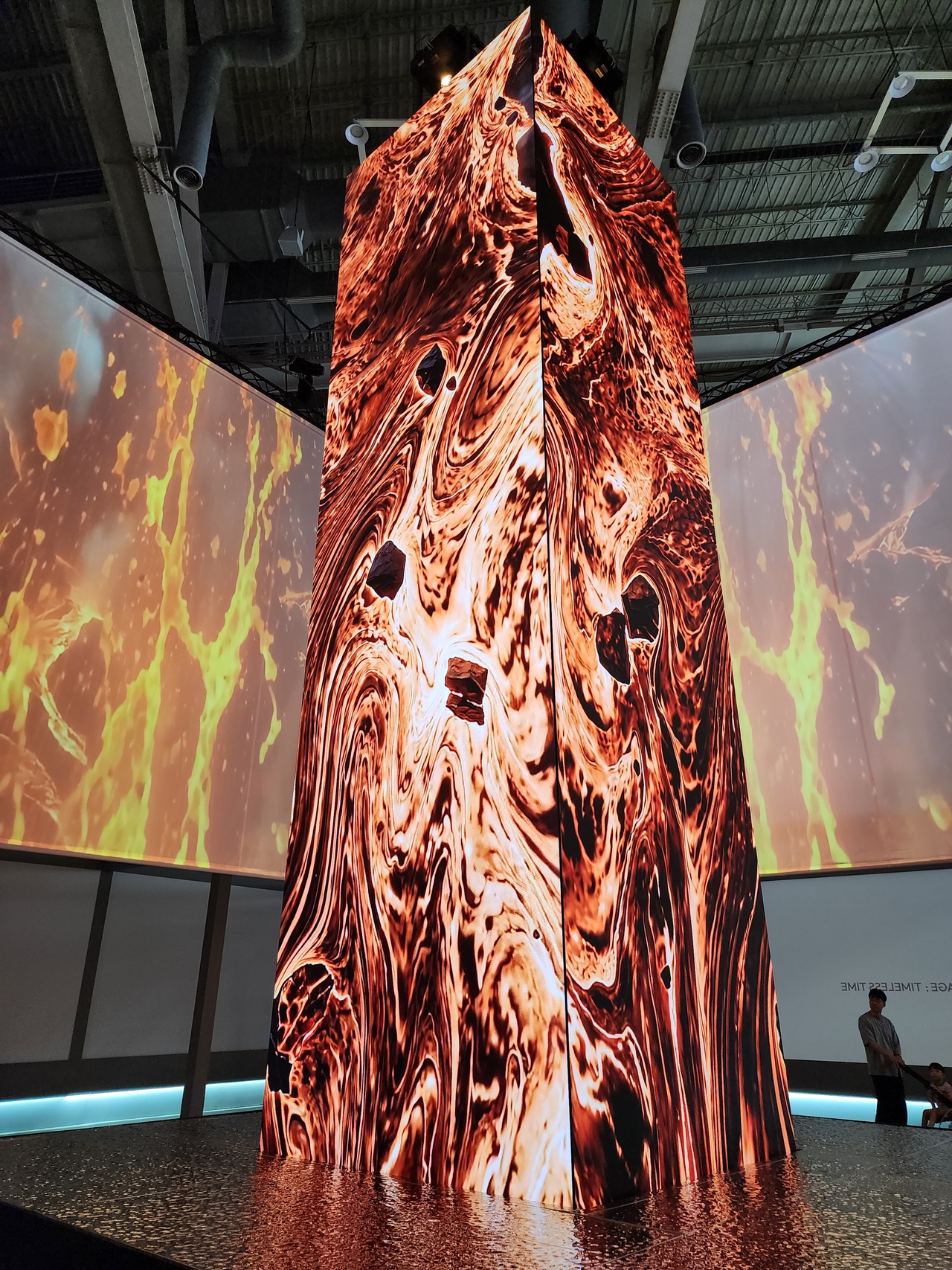 Jeju Volcanic Island and Lava Tubes are featured on a towering LED media pillar at the exhibition "Timeless Time" in the K-Heritage House during the 48th session of the UNESCO World Heritage Committee at Bexco in Busan on Monday. (Hwang Dong-hee/The Korea Herald)