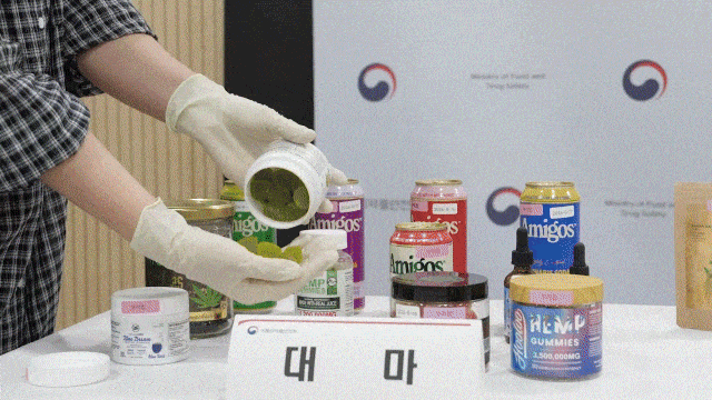 Ministry of Food and Drug Safety employees display and test imported food including illegal substances. (Ministry of Food and Drug Safety)