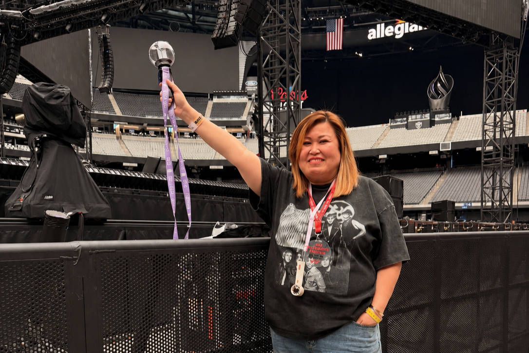 Carol Peregrino poses with an Army Bomb, BTS' official light stick, during BTS' "Arirang" tour in Las Vegas in May. (Carol Peregrino)