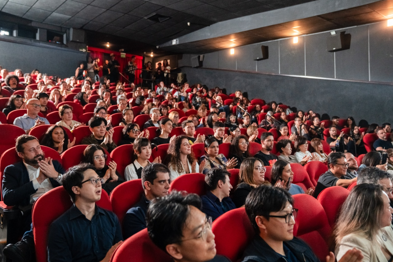 Hyundai Motor Brazil employees and local residents applaud after a film screening at a Korean film festival held in Brazil last year. [Hyundai Motor Group]
