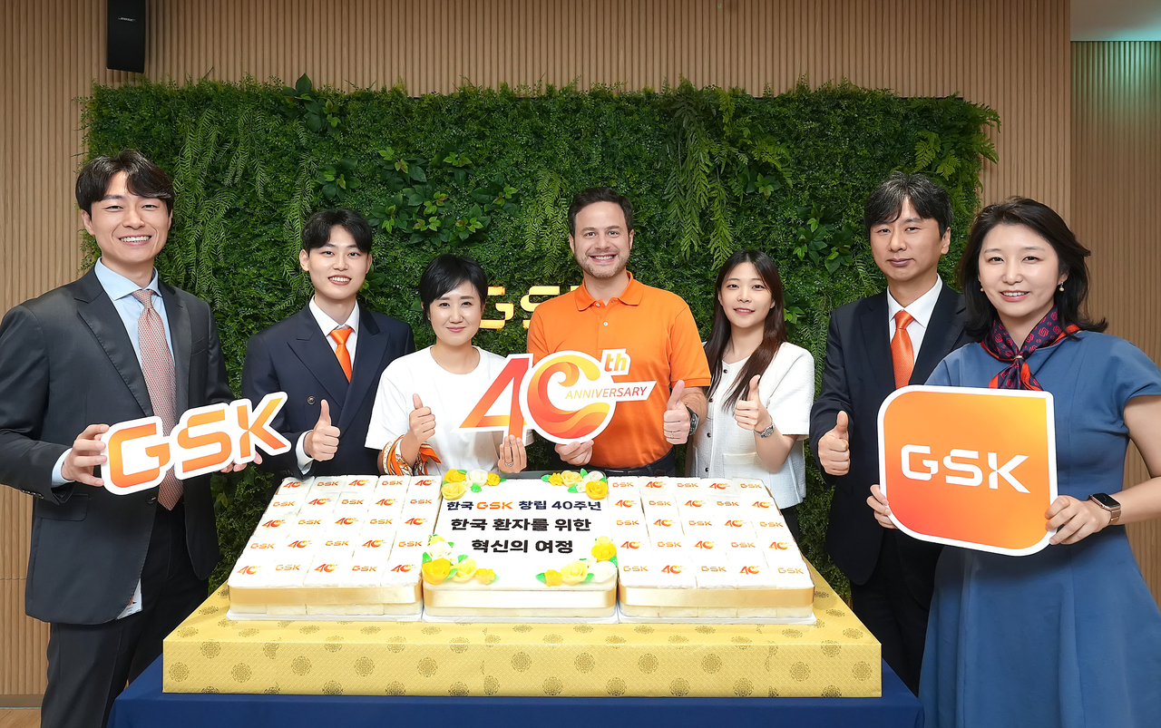 GSK Korea officials, including Country President Gunnar Riediger (center), pose for a photo during an event marking the firm's 40th anniversary on July 8. (GSK Korea)