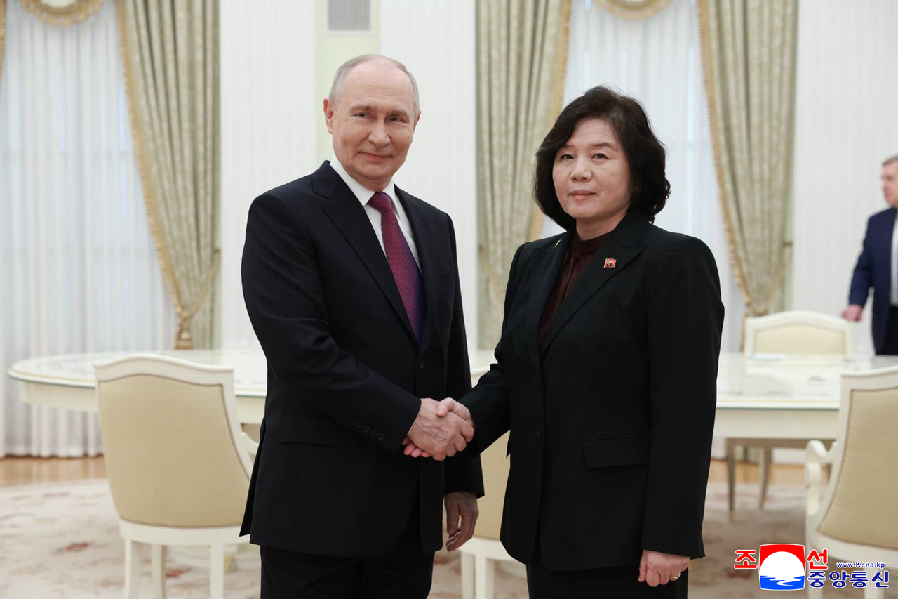 North Korean Foreign Minister Choe Son-hui (R) and Russian President Vladimir Putin shake hands during their meeting at the Kremlin in Moscow on July 19. (KCNA via Yonhap)