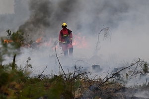 France and Spain battle wildfires as more than 250,000 people are forced to flee homes