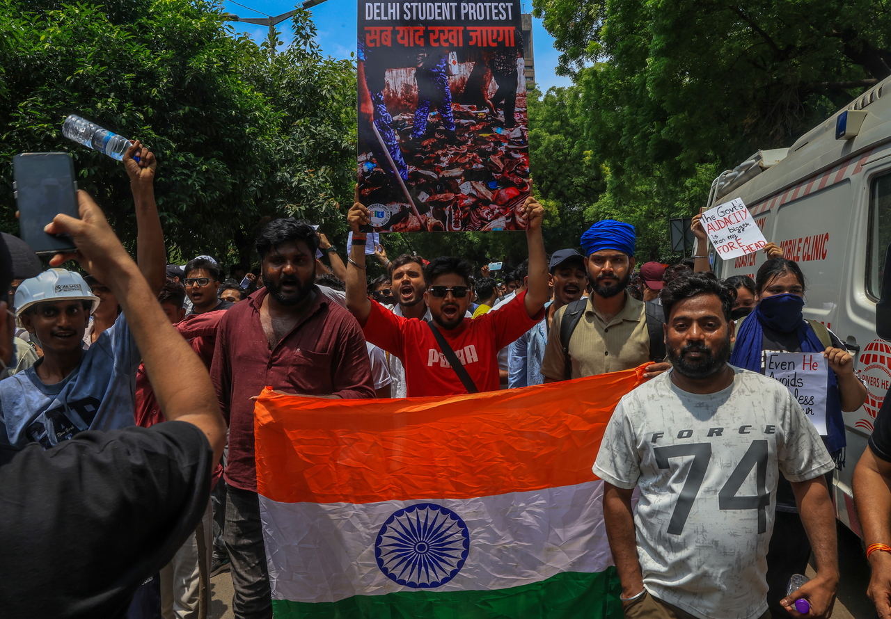 Supporters of the youth-led satirical political movement Cockroach Janta Party take part in a demonstration in New Delhi, Saturday. (EPA-Yonhap)
