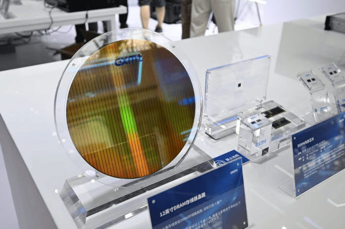 DRAM wafers and memory chips on display at a CXMT exhibition stand in Hefei, China (AFP)