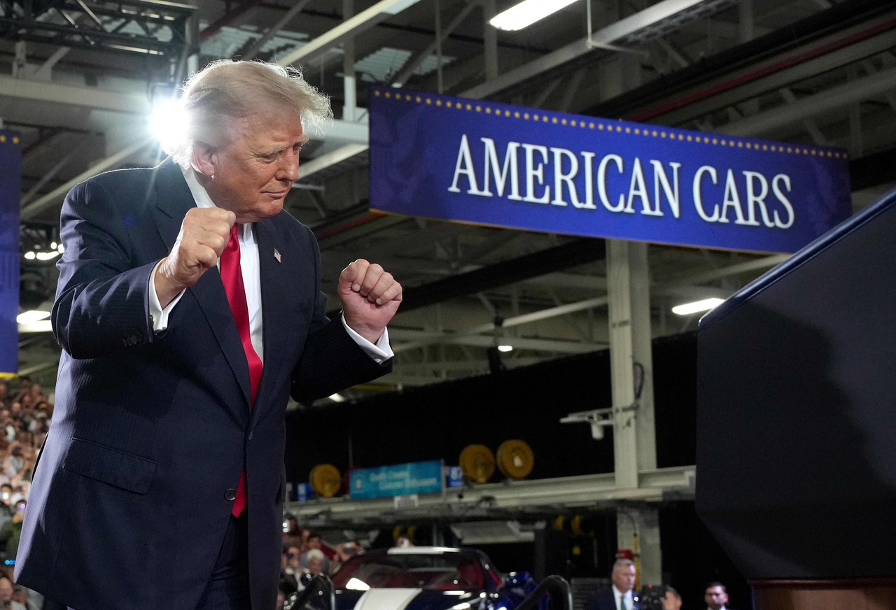 President Donald Trump dances to music before taking the stage at General Motors' Milford Proving Ground in Milford, Michigan, on Monday. [AFP]