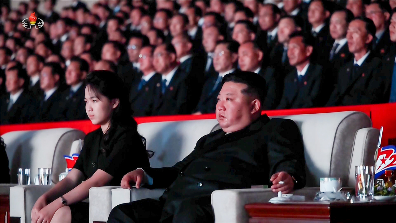 North Korean leader Kim Jong-un sheds tears while attending a performance marking the 73rd anniversary of Victory Day, commemorating the Korean War armistice, in Pyongyang on Monday. His daughter, Kim Ju-ae, is seated to his left. (Korean Central Television via Yonhap)