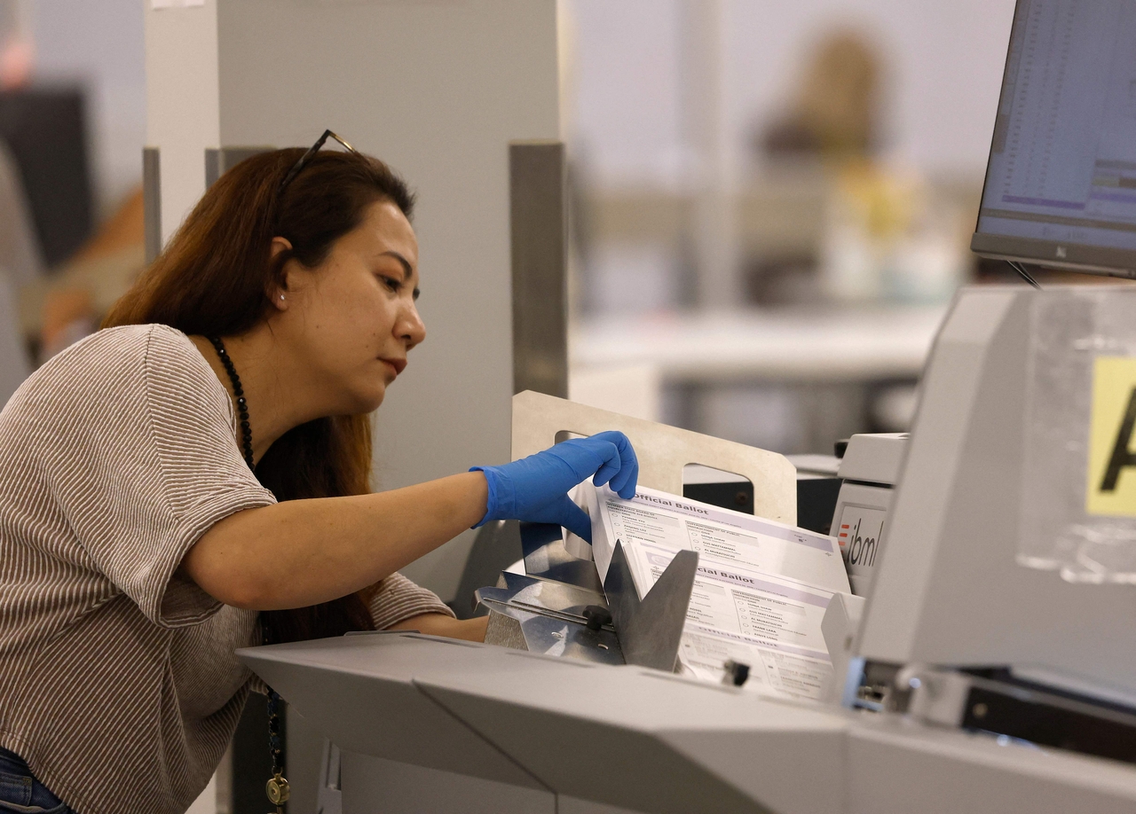 An election worker processes ballots for the state primary election in Los Angeles in June. (AFP-Yonhap)