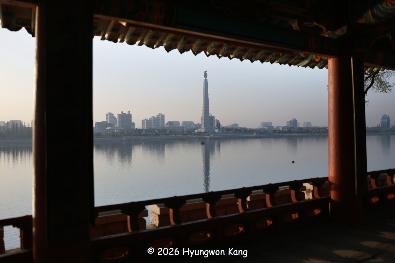 The Juche Tower is seen across the Taedong River in the early morning in Pyongyang. Central Pyongyang lies on an island between two rivers. (Hyungwon Kang)