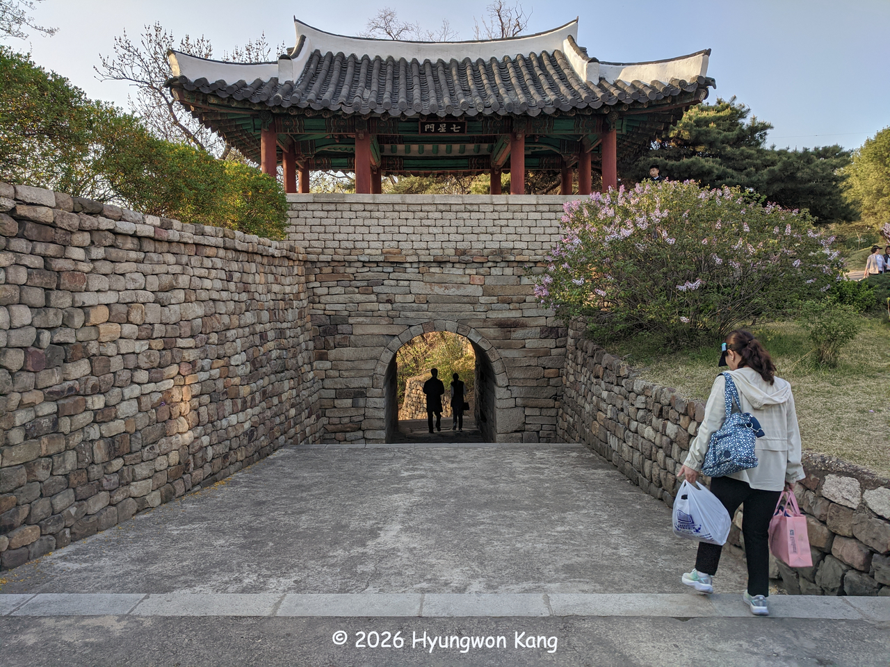 Pyongyang residents walk through Chilsongmun gate, designated as National Treasure No. 17, the northern gate of Pyongyang Fortress, in Pyongyang. (Hyungwon Kang)