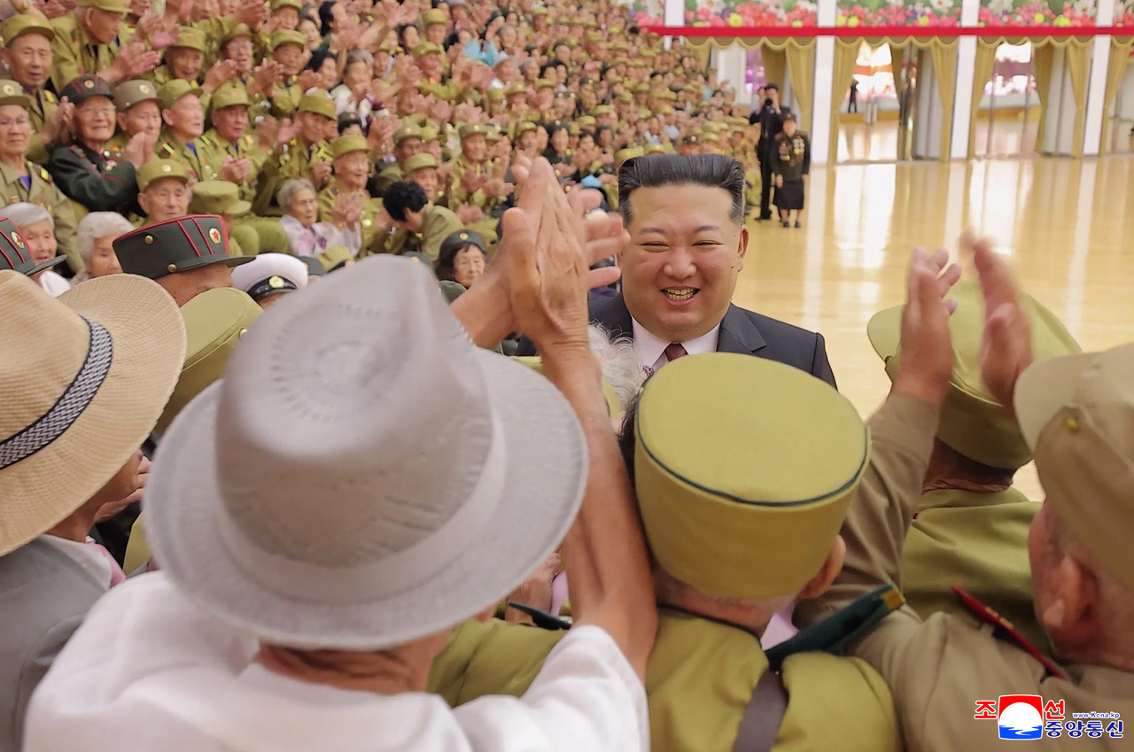 North Korean leader Kim Jong-un meets war veterans and individuals honored for their wartime service during an event marking the 73rd anniversary of the Korean War Armistice Agreement, commemorated in North Korea as "Victory Day," on July 28, in this photo released by the Korean Central News Agency on July 29, 2026. (Yonhap)