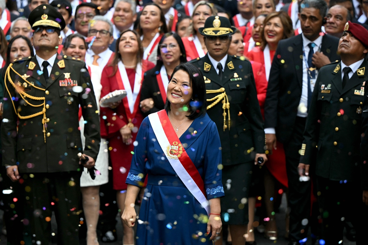 Peru's President Keiko Fujimori (front center) walks toward the Government Palace after leaving Congress following her inauguration ceremony in Lima, Peru, Tuesday. (AFP-Yonhap)