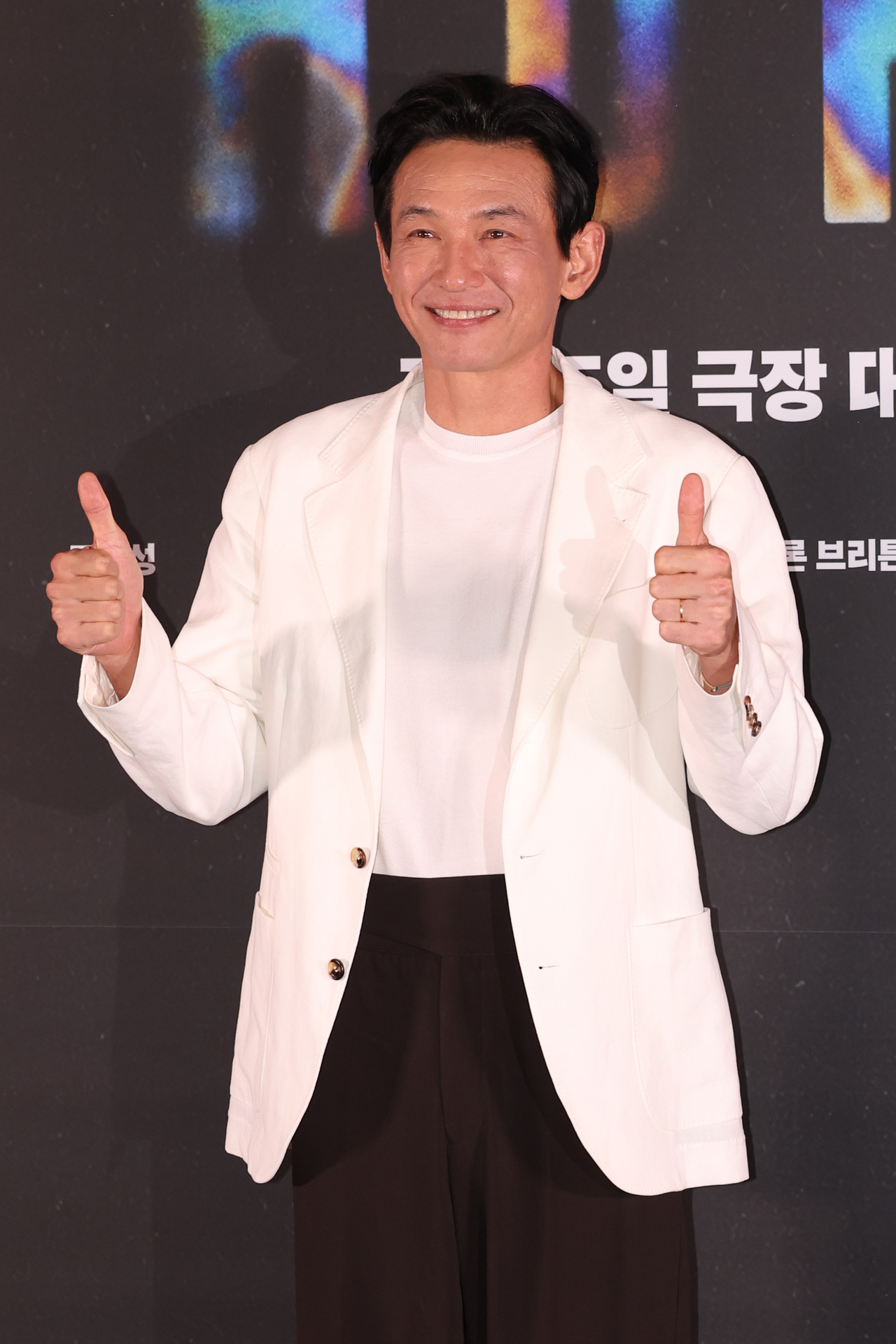 Hwang Jung-min poses for a photo during a press conference for "Hope" at Megabox Coex in Seoul, July 6. (Yonhap)