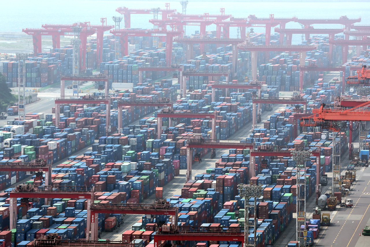 Containers are stacked at Sinseondae Pier in Busan Port. [Yonhap]