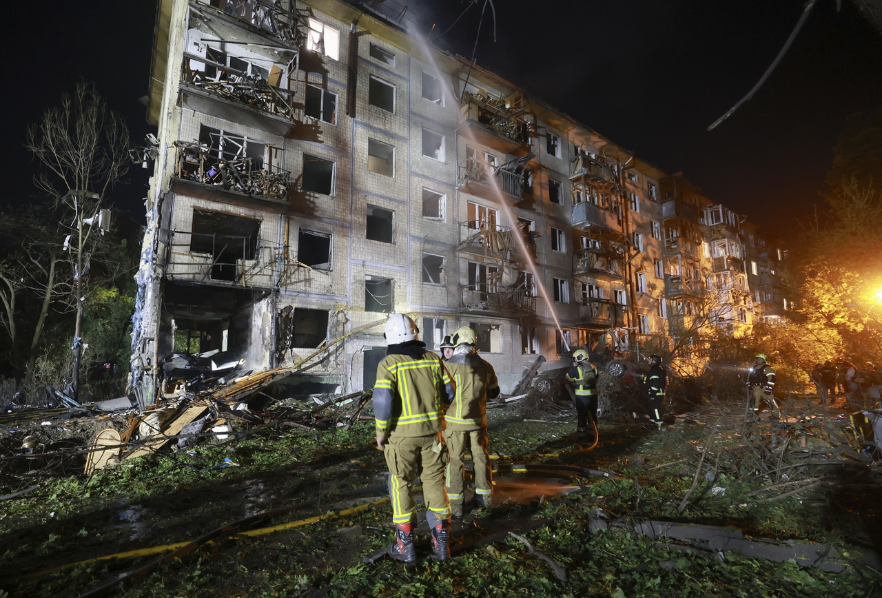 Rescuers work at the site of a Russian missile strike on a residential building in Kyiv, Ukraine, Saturday. (EPA-Yonhap)