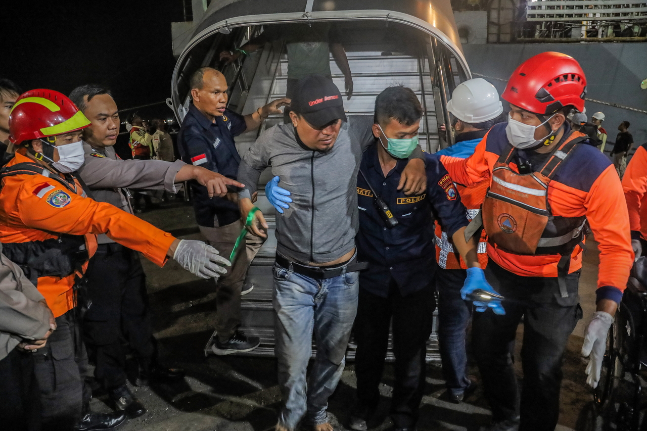 A survivor of a ferry fire arrives at Tanjung Perak Port in Surabaya, East Java, Indonesia, Monday. (EPA-Yonhap)