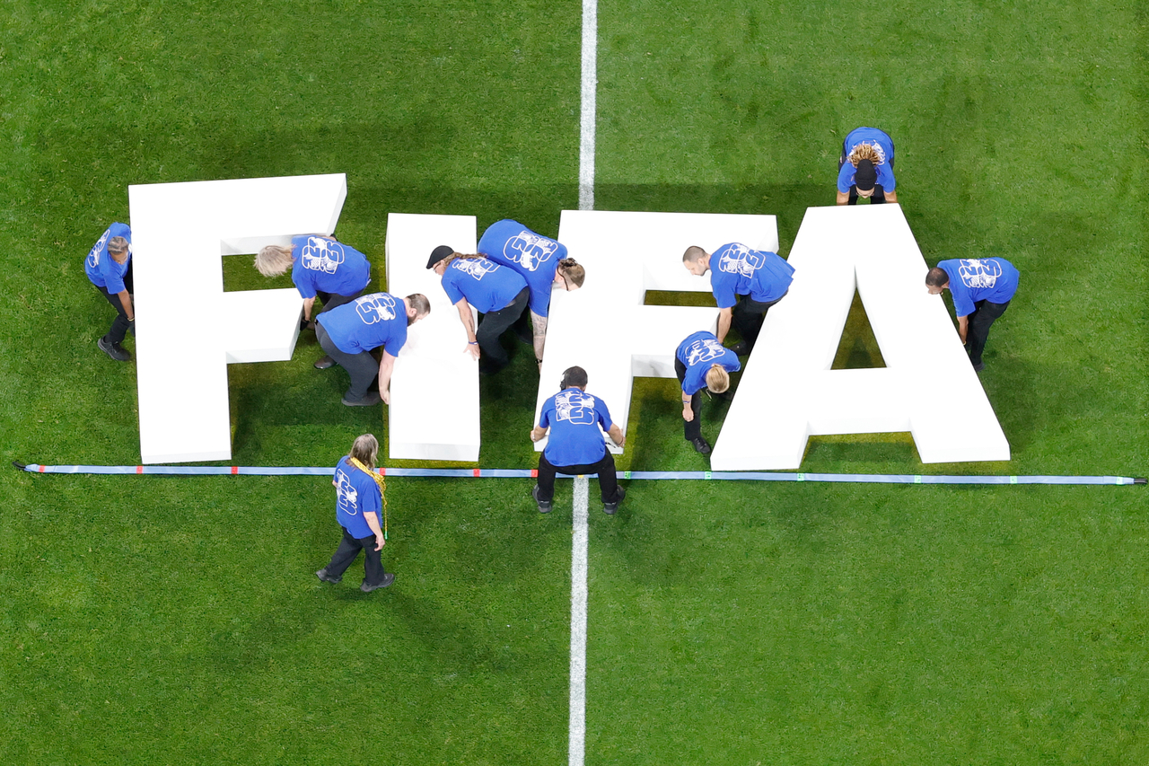 Staff place a FIFA logo on the pitch prior to the World Cup 2026 match between Argentina and Egypt, in Atlanta, July 7.   (AP-Yonhap)