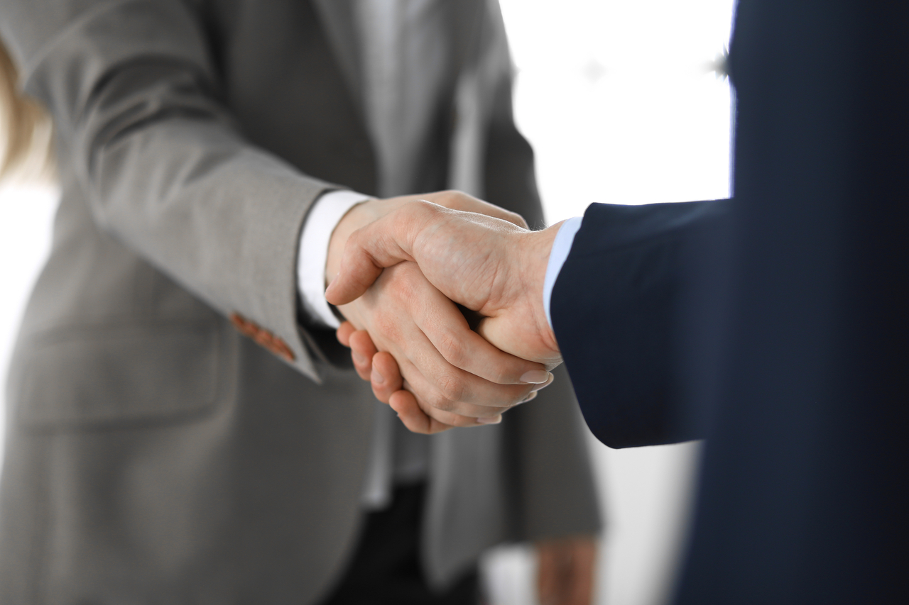 A stock image of two people shaking hands. (123rf)