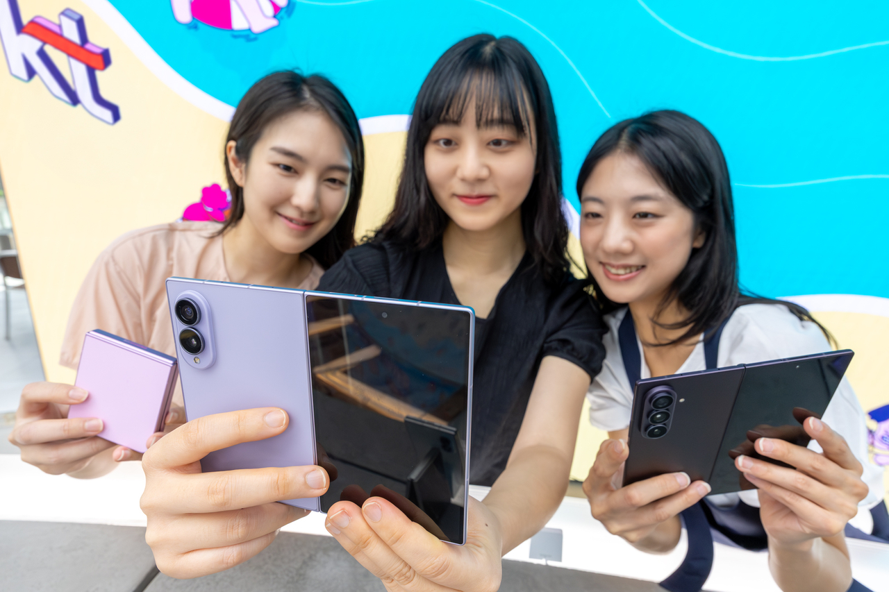 A model introduces the Galaxy Z Fold 8, Fold 8 Ultra and Flip 8 at a KT Corp store. [KT Corp]