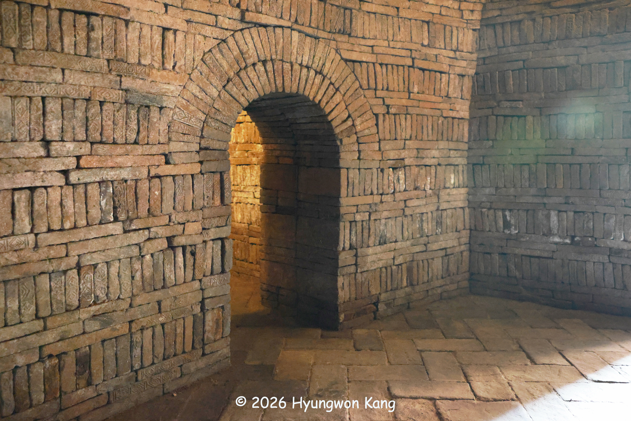 The interior of a reconstructed Rangnang brick-chamber tomb features several arched openings connecting burial chambers intended for the afterlife, at Rangnangguk Museum in Pyongyang. (Hyungwon Kang)