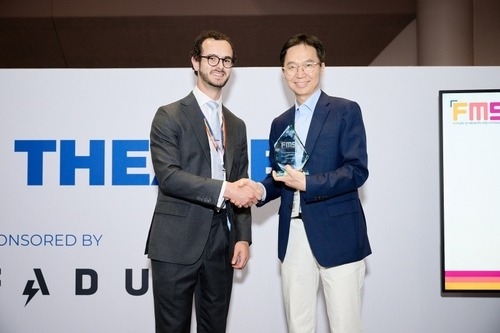 This image, provided by Samsung Electronics Co. on Thursday, shows a company official receiving awards at the Future of Memory and Storage 2026 conference held in California. (Yonhap)